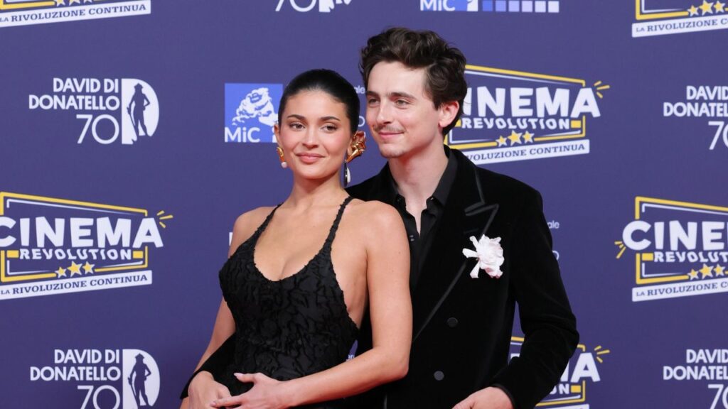 Watch Timothée Chalamet awkwardly dodge Kylie Jenner's kiss during their red carpet debut, creating an uncomfortable moment